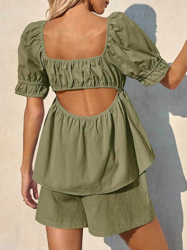 Back view of olive green puff sleeve two-piece babydoll set showing cut-out back detail and flowy fit, styled for warm-weather comfort.